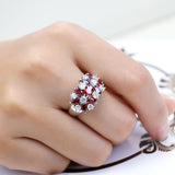 BAGUE FLEUR EN ARGENT AVEC CLUSTER DE GRENAT ROUGE