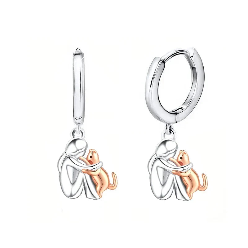 Boucles d'oreilles en forme d'étreinte de chat en argent et or bicolore